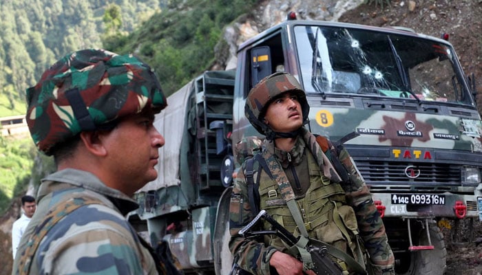 Indian soldiers stand next to a vehicle in Kathua district of Indian Illegally Occupied Jammu & Kashmir (IIOJK) on July 9, 2024. — Reuters