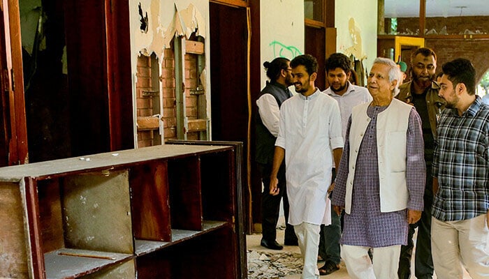 Muhammad Yunus (Centre) leader of the caretaker government of Bangladesh visiting Bangladeshs ex-pms palace. —AFP/File