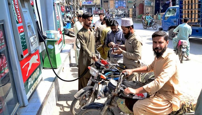 A large number of bikers can be seen at a petrol pump at Qasimabad, Hyderabad, on November 24, 2021. — INP