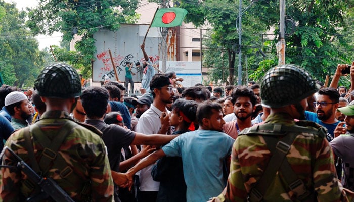 A representational image showing Bangladeshi troops standing guard during a demonstration. — Reuters/File