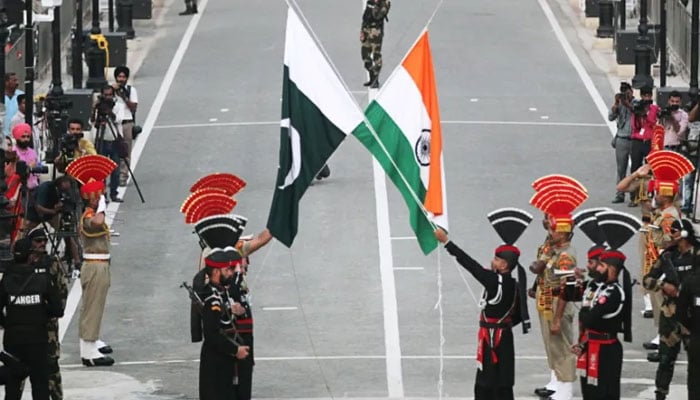 Pakistan and Indian soldiers seen are a cermony at the Wahgah border Lahore. — Reuters/file