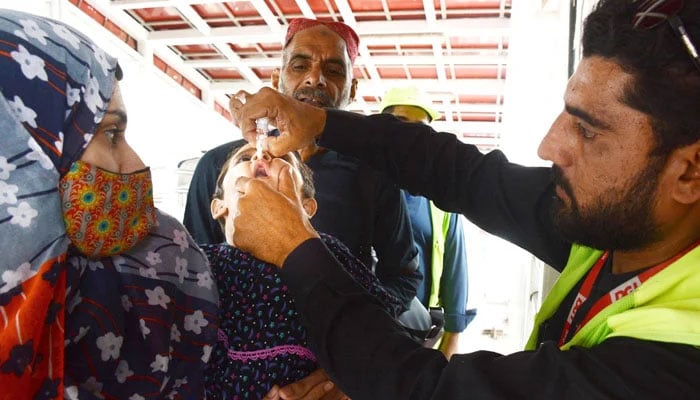 A health worker administers polio drops to a child during the Polio Free Pakistan campaign in Islamabad on October 28, 2024. — INP