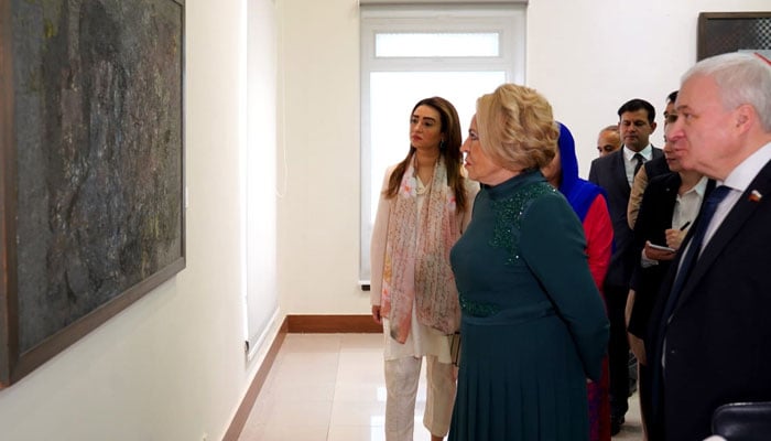 A Russian delegation led by Valentina Mat­vienko, Federation Council of the Russian Federation (centre) looks at a painting at  the Pakistan National Council of the Arts on October 29, 2024. — Facebook@PNCAOfficial