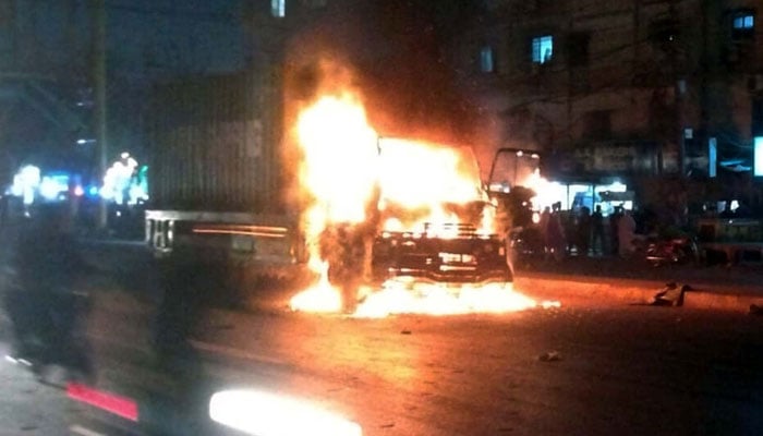 View of a burning dumper, torched by an angry mob after an accident killed a motorist, at Shahrah-e-Pakistan area in Karachi on October 29, 2024. — PPI