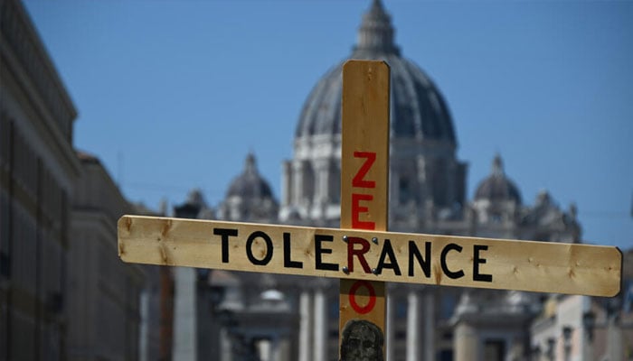 A zero tolerance  sign in front of a church.— AFP/file