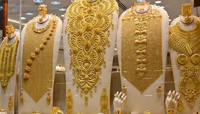 The picture shows gold necklaces on display. — AFP/File