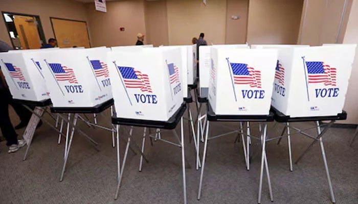 Poll workers with the Hillsborough County Supervisor of Elections Office, work to setup early voting equipment at the Seffner-Mango Branch Library in Seffner, Florida, US, August 2, 2024. — Reuters