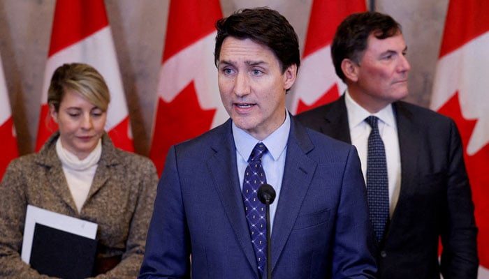 Canadas Prime Minister Justin Trudeau, with Minister of Foreign Affairs Melanie Joly, and Minister of Public Safety, Democratic Institutions and Intergovernmental Affairs Dominic LeBlanc, takes part in a press conference. — Reuters/File