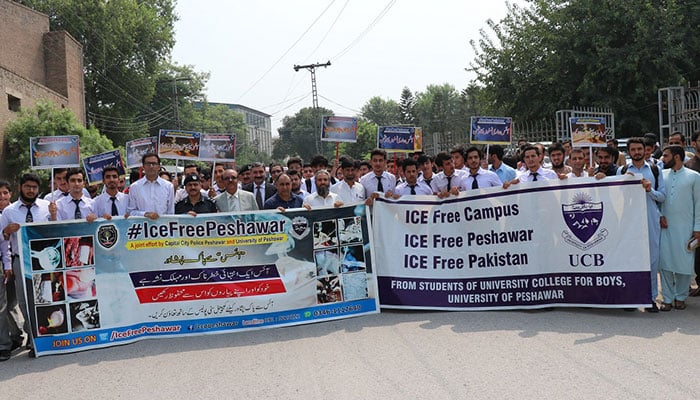 Students holding banners in an anti-drug awareness walk on Mall Road as part of the province-wide Drug-Free Peshawar campaign on October 31, 2024. — uop.edu.pk