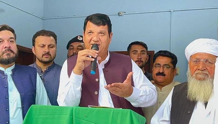 A representational image of Federal Minister for States and Frontier Regions and President PML-N KP, Engr Amir Muqam addressing Jirga Members.— APP/File