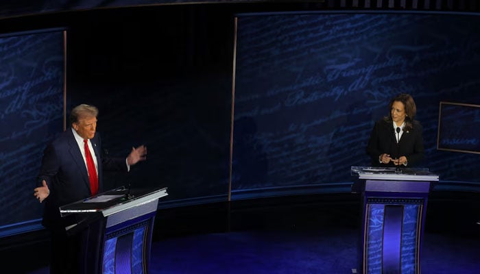 Republican presidential nominee, former US President Donald Trump speaks as Democratic presidential nominee, US Vice President Kamala Harris listens as they attend a presidential debate hosted by ABC in Philadelphia, Pennsylvania, US, on September 10, 2024. — Reuters