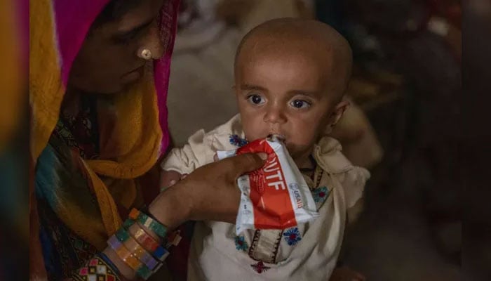 In this representational image, a woman feeds her child. — unicef.org/file