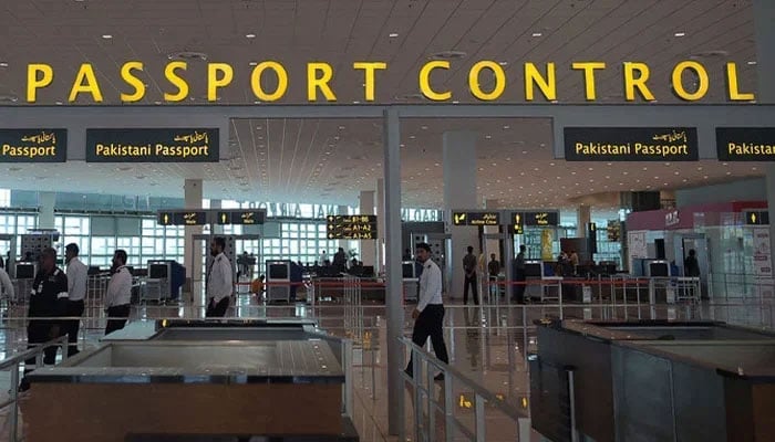 In this photograph taken on April 26, 2018, airport staff walks through the Islamabad International Airport on the outskirts of Islamabad. — AFP