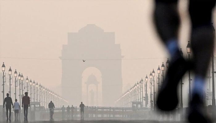 The India gate seen with smog around it. — AFP/file