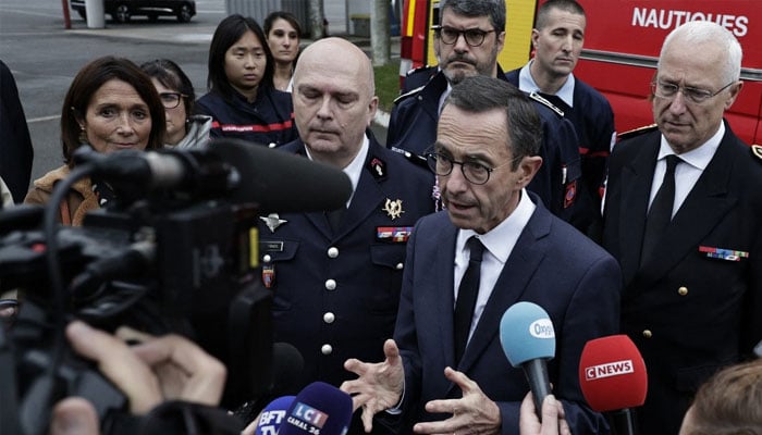 Interior Minister Bruno Retailleau (centre) addressing the press. — AFP/file