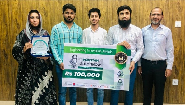 Punjab University Institute of Metallurgy & Materials Engineering (IMME) students receiving a cash prize for winning first position in ‘Engineering Innovation Award 2024’at Pakistan Auto Show 2024.— Facebook@immepu/file