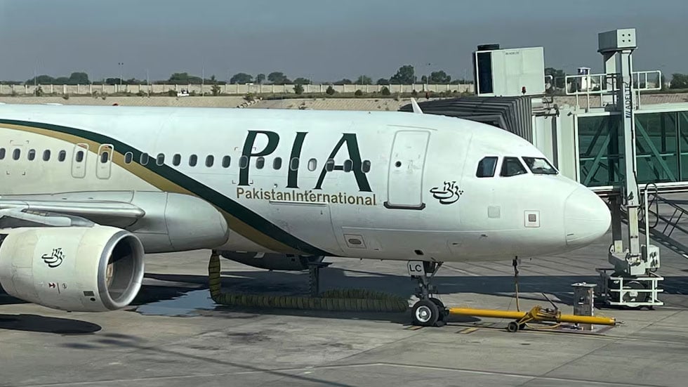 View of the Pakistan International Airlines (PIA) passenger plane, taken through a glass panel, at Islamabad International Airport, Pakistan October on 3, 2023. — Reuters