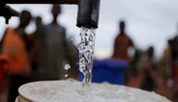 The representational image shows people waiting for their turn to fill their cans with water. — APP/File