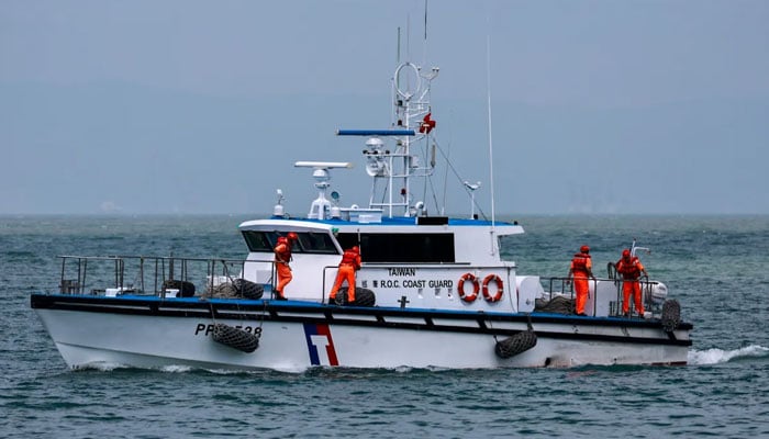 Taiwanese Coast Guard personnel work on a vessel off the coast of Nangan Township, in the Matsu Islands on Oct. 15, 2024, a day after China conducted the “Joint Sword-2024B” military drills around Taiwan. —AFP