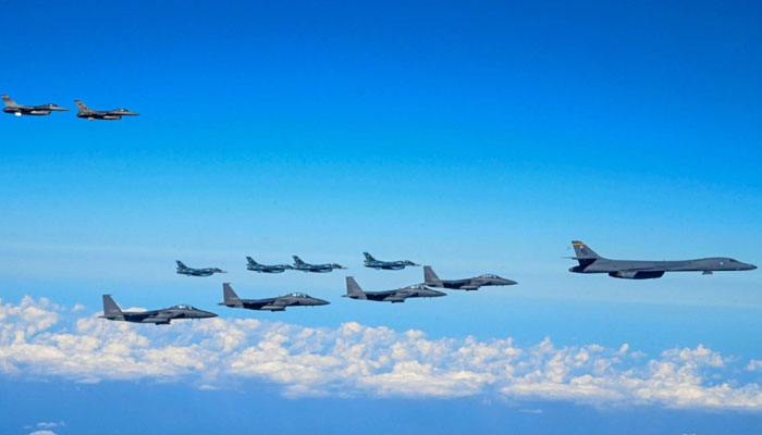 A US Air Force B-1B bomber (front) flies in formation with South Korean, Japanese and U.S. fighter jets during a joint air drill in South Korean airspace south of Jeju Island on Sunday.— AFP/File