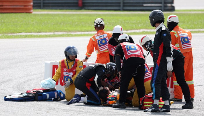 Marshals assist Red Bull KTM Factory Racings Jack Miller after his crash during the MotoGP. — Reuters/file