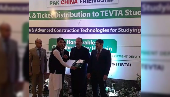 Provincial Minister for Industries and Commerce Chaudhry Shafay Hussain distributes visa and air ticket to a student on November 4, 2024. — Screengrab via Facebook@tevtianpunjab