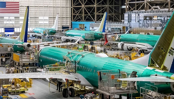 Workers assembling new air crafts in a a workshop at Boeing company.— www.boeing.com/File