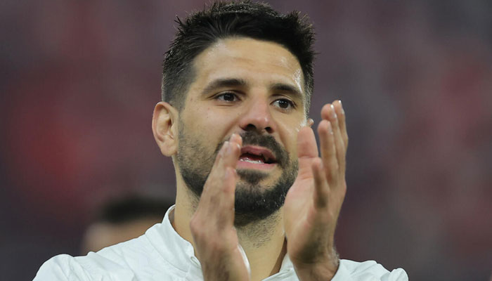 Serbias record goal-scorer Aleksandar Mitrovic clapping.—AFP/File