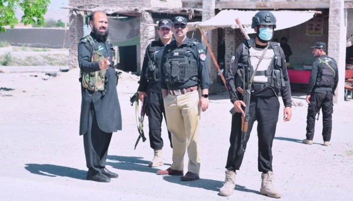 Representational image show KP police personnel stand guard on the road on May 6, 2024. — Facebook@BannuPoliceKPK