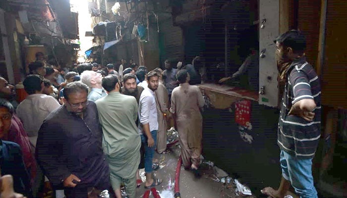 Fire brigade officials extinguish fire in Bolton Market, Karachi on November 5, 2024. — PPI