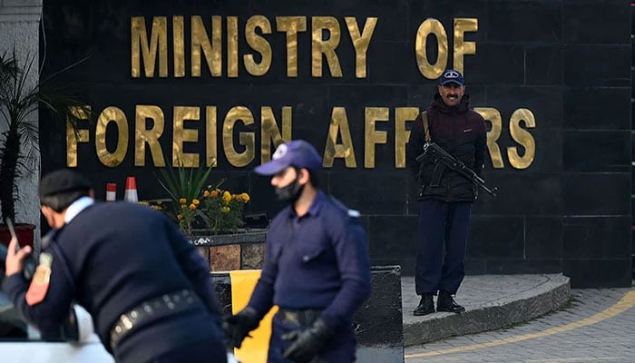 A security personnel stands guard outside the office of the Ministry of Foreign Affairs in Islamabad. — AFP/File