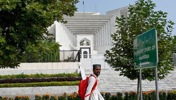 A man walks past the Pakistans Supreme Court building in Islamabad on October 23, 2024. — AFP