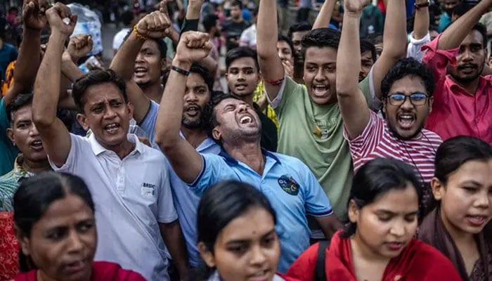 Members of the Bangladeshi Hindu community chant slogans against violence targeting the countrys minorities during a protest in Dhaka on August 9, 2024, days after a student-led uprising ended the 15-year rule of Sheikh Hasina. — AFP