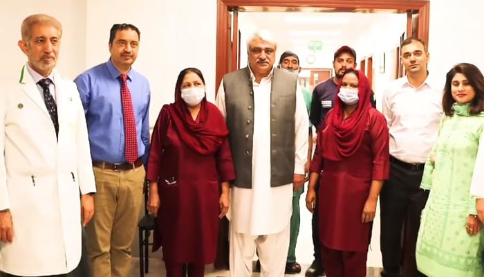 Provincial Health Minister Khawaja Salman Rafique (centre) pose for a group photo after inaugurating the resumption of Avastin Intravitreal injection and new ophthalmology equipment in Mayo Hospital Lahore on November 6, 2024. — Screengrab via Facebook@SalmanRafiquePK