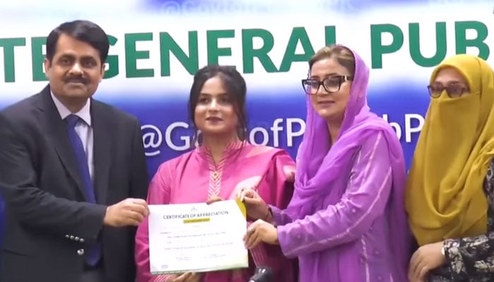 Punjab Information Minister Azma Bokhari (from right to 2nd) distributes a certificate to a student at the Directorate General Public Relations (DGPR) on November 6, 2024. — Screengrab via Facebook@AzmaBokhariPMLN