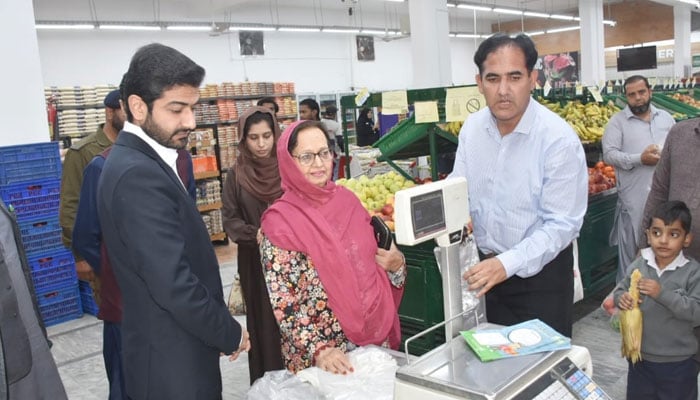 Member National Assembly Tahira Aurangzeb and DC, Rawalpindi Hassan Waqar Cheema (left)  review the measures taken to deal with plastic shopping bags in a commercial centre in Rawalpindi on November 6, 2024. — Facebook@dcorawalpindi