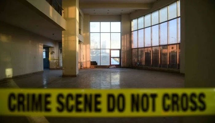 Representational image shows a police tape at a crime scene. — AFP/File