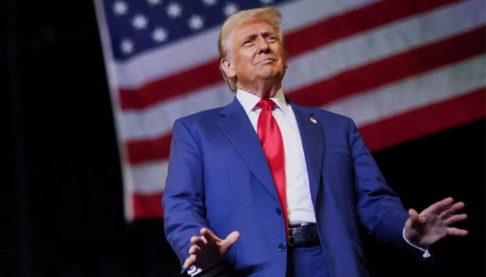 President-elect Donald Trump gestures during a rally in Novi, Michigan, US on October 26, 2024. — Reuters