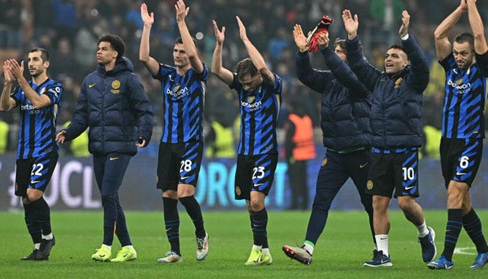 Inter Milans players celebrate with their fans after Wednesdays win over Arsenal. — AFP/File