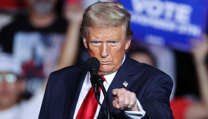 President-Elect Donald Trump gestures during a rally, in Henderson, Nevada,US on October 31, 2024. — Reuters