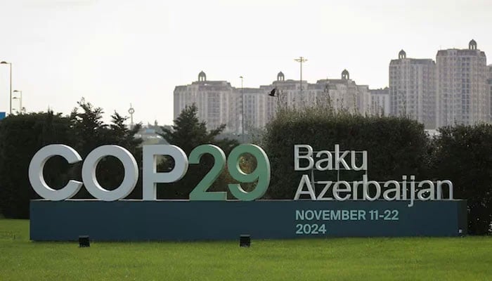 A view shows a sign of the COP29 United Nations Climate Change Conference with a backdrop of the cityscape in Baku, Azerbaijan on October 31, 2024. — Reuters