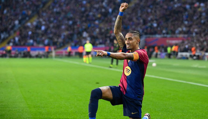 Barcelona’s Brazilian forward Raphinha celebrates scoring their second goal during the Spanish league football match against RCD Espanyol at the Estadi Olimpic Lluis Companys in Barcelona. — AFP/file