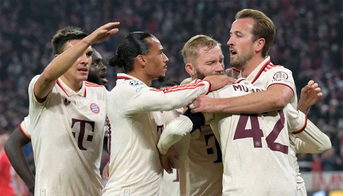 Bayern Munich´s German midfielder Jamal Musiala (2nd right) celebrates with teammates after scoring the 1-0 opening goal during the UEFA Champions League football match FC Bayern Munich vs SL Benfica in Munich, southern Germany, on November 6, 2024. — AFP