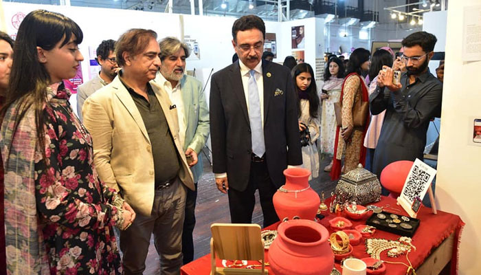 PU Vice Chancellor Prof Dr Muhammad Ali (right) looks at artwork during a thesis exhibition at the Punjab University’s Department of Graphic Design, Old Campus on November 8, 2024. — Facebook@UniversityOfThePunjab.Official