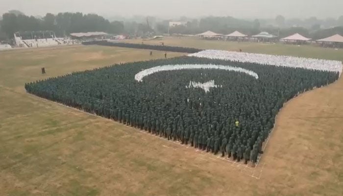 The image shows worlds largest human flag made by over 10,000 students the Army Public School (APS) Lahore. — APP/File