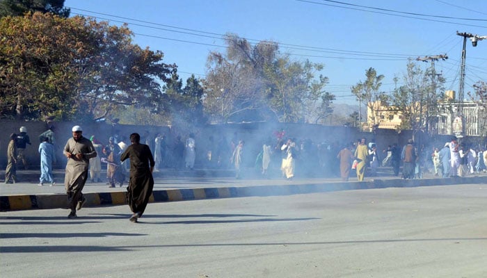 Police officials fired tear gas to repel protesters during the Tehreek-e-Insaf (PTI) rally, in Quetta on Friday, November 8, 2024.— PPI