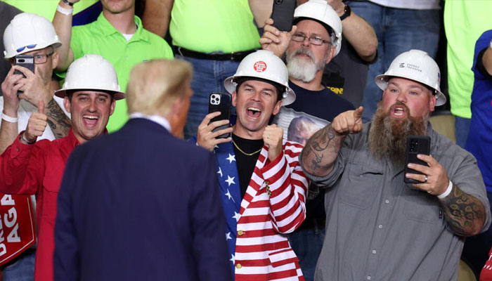 US President-elect Donald Trump seen with young men cheering for him at a rally. — AFP/file