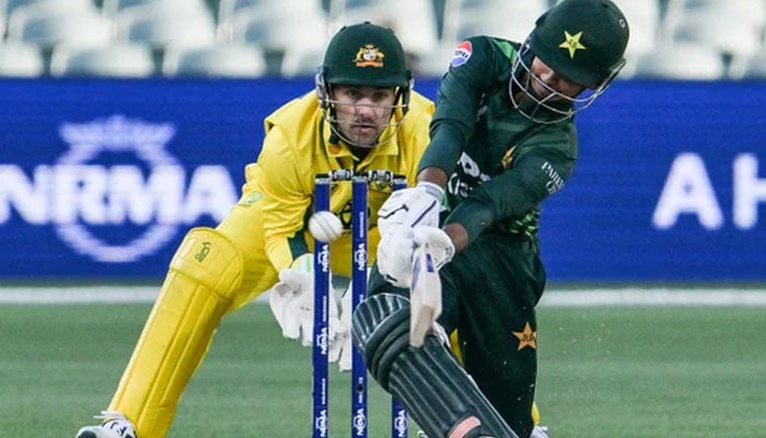 Pakistan’s Saim Ayub (right) hits a six watched by Josh Inglis. — AFP/File