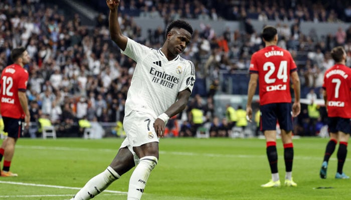 Real Madrids Brazilian forward Vinicius Junior celebrates scoring his teams first goal in the rout of Osasuna. —AFP/File