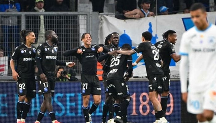 Auxerre’s players celebrate their third goal during the Ligue 1 match against Marseille at Stade Velodrome in Marseille.— AFP/File